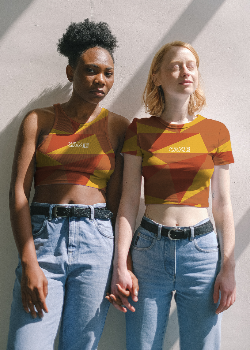two women holding hands with the company tshirts on