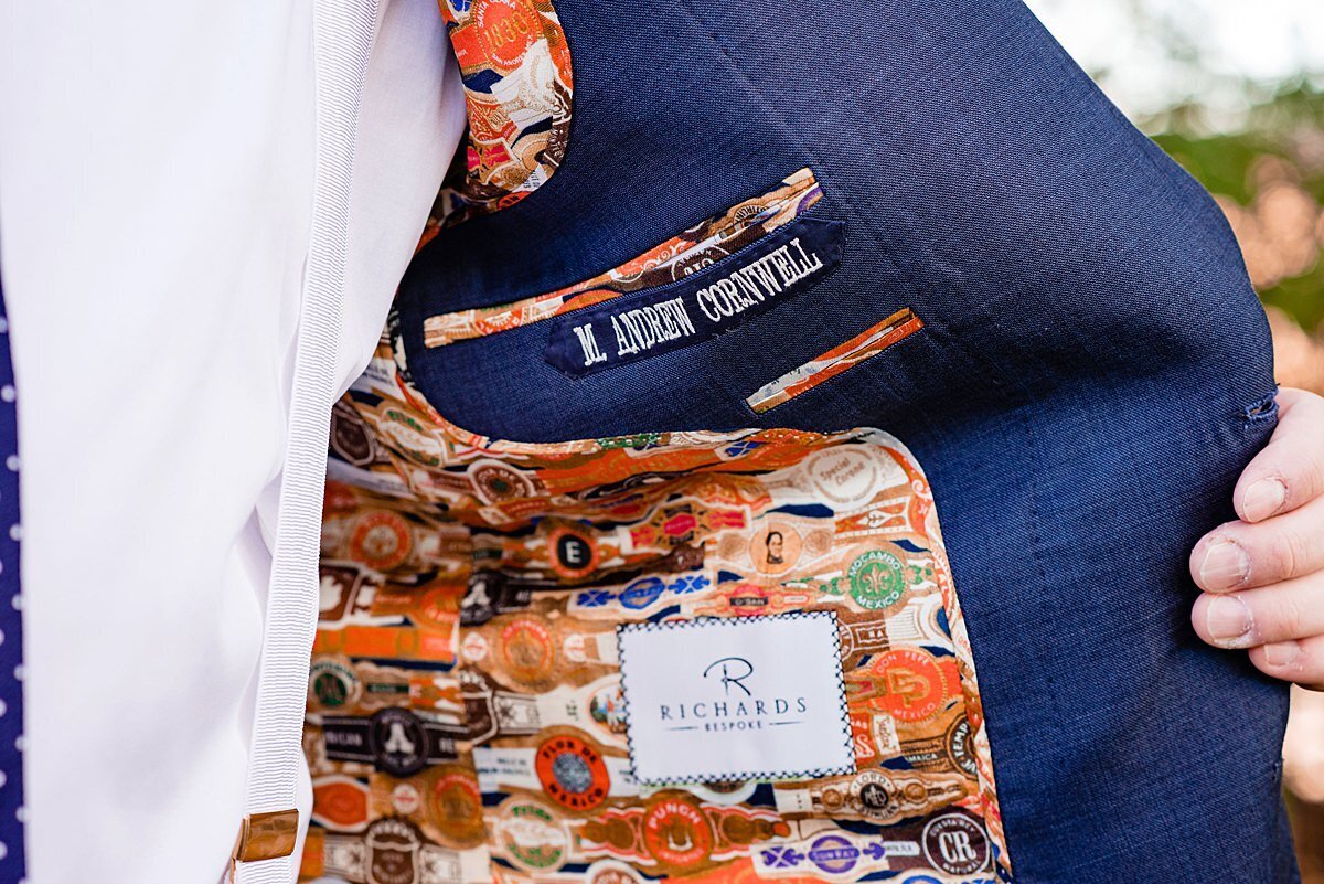 Custom suit jacket lining with all of the groom's favorite cigar band labels printed inside.
