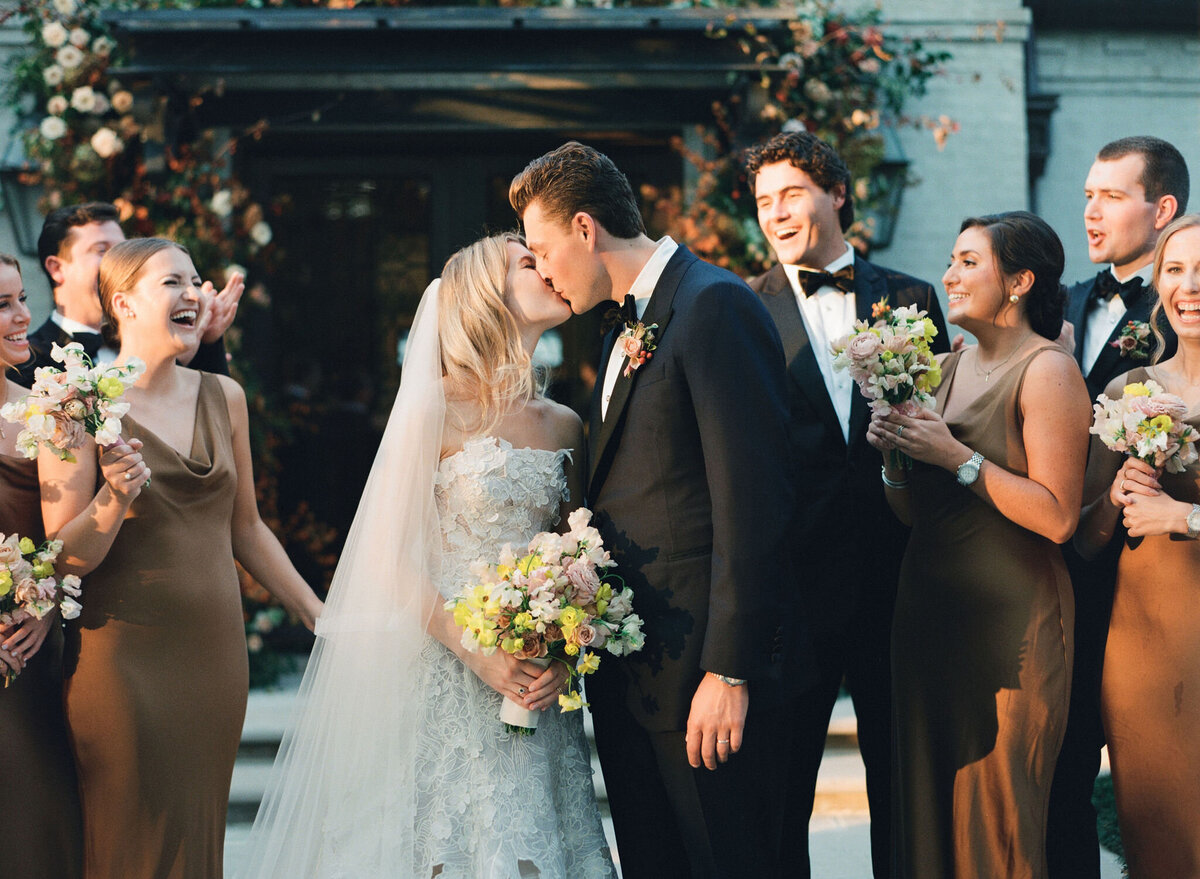 Product clustered bridal bouquet with sweet peas, local zinnias, and butterfly ranunculus. Elegant and simple bridal bouquet and bridal party bouquets with hues of blush and pops of yellow. Unique fall wedding design for private residence wedding in Nashville, TN. Bridal party wearing brown and wedding design with touches of brown. Design by Rosemary & Finch Floral Design in Nashville, TN.