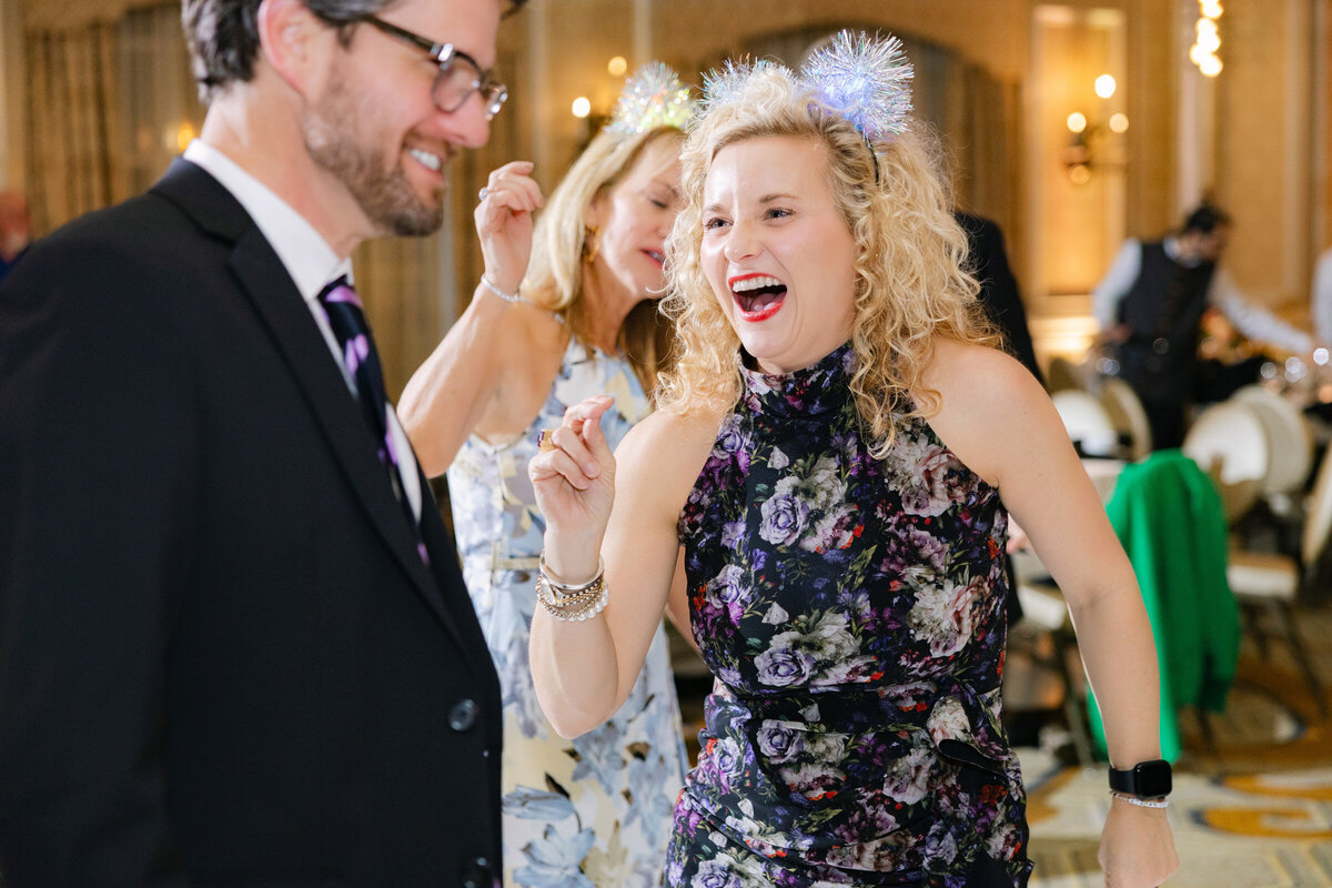 candid moment of a guest dancing and laughing atThe Adolphus in Dallas 