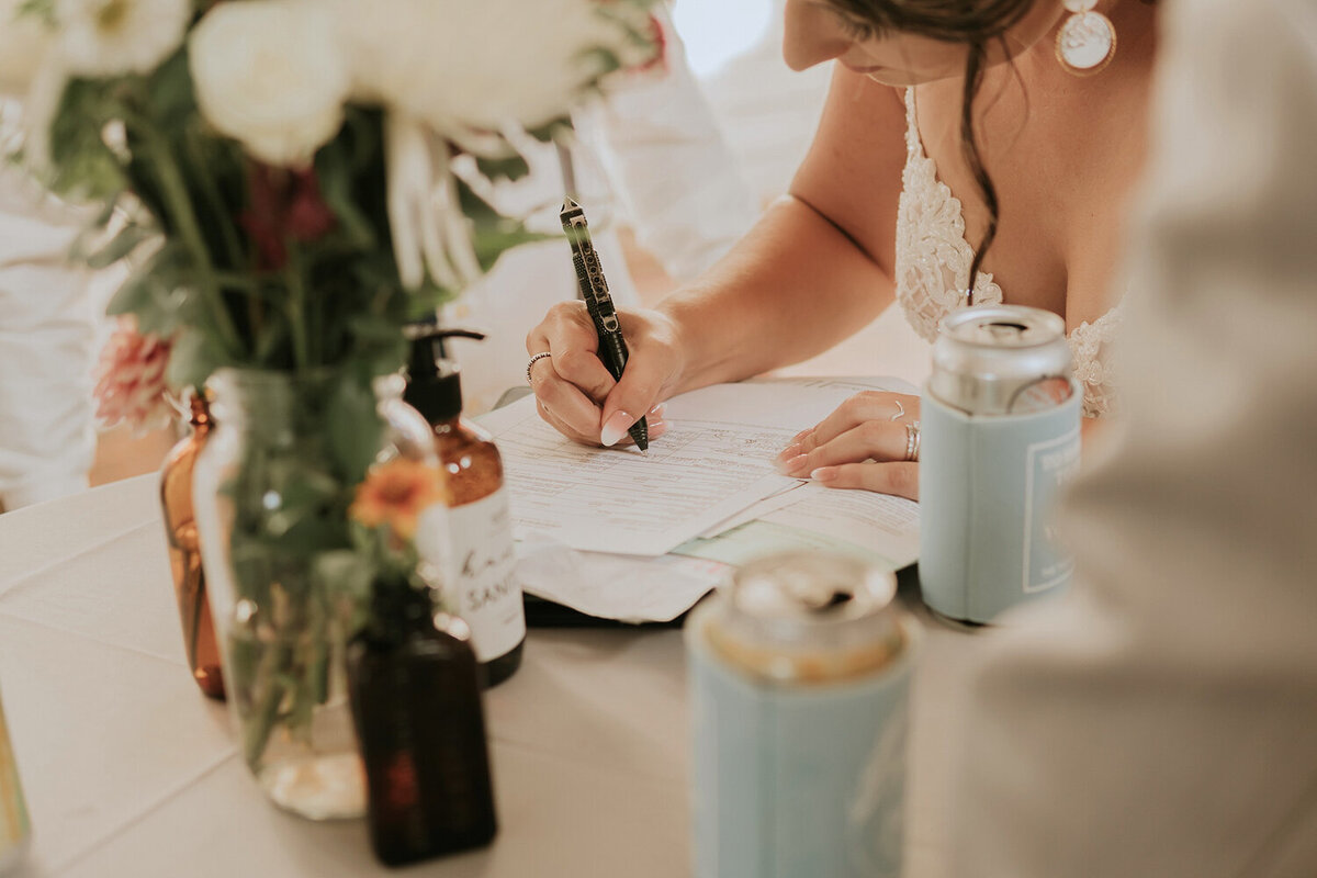 signing-marriage-license-wedding-detail-shot-iowa-storyteller-collective-photo-co