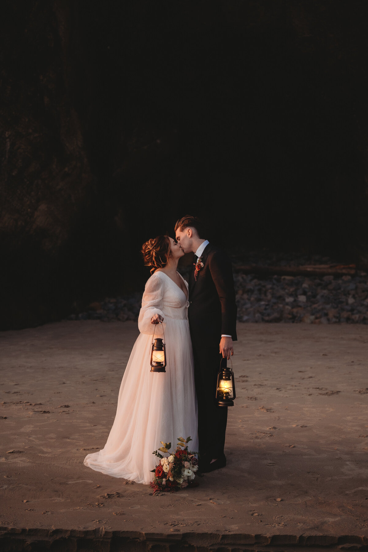 Couples kissing on beach taken by Edmonton Alberta Photographer