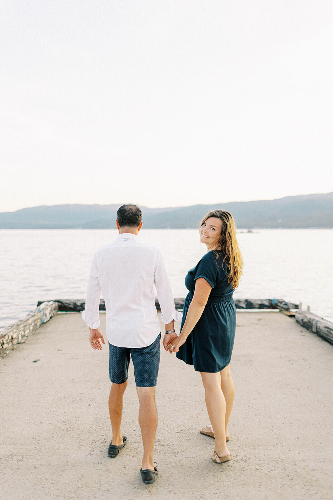 man-walking-while-female-looks-back-at-camera