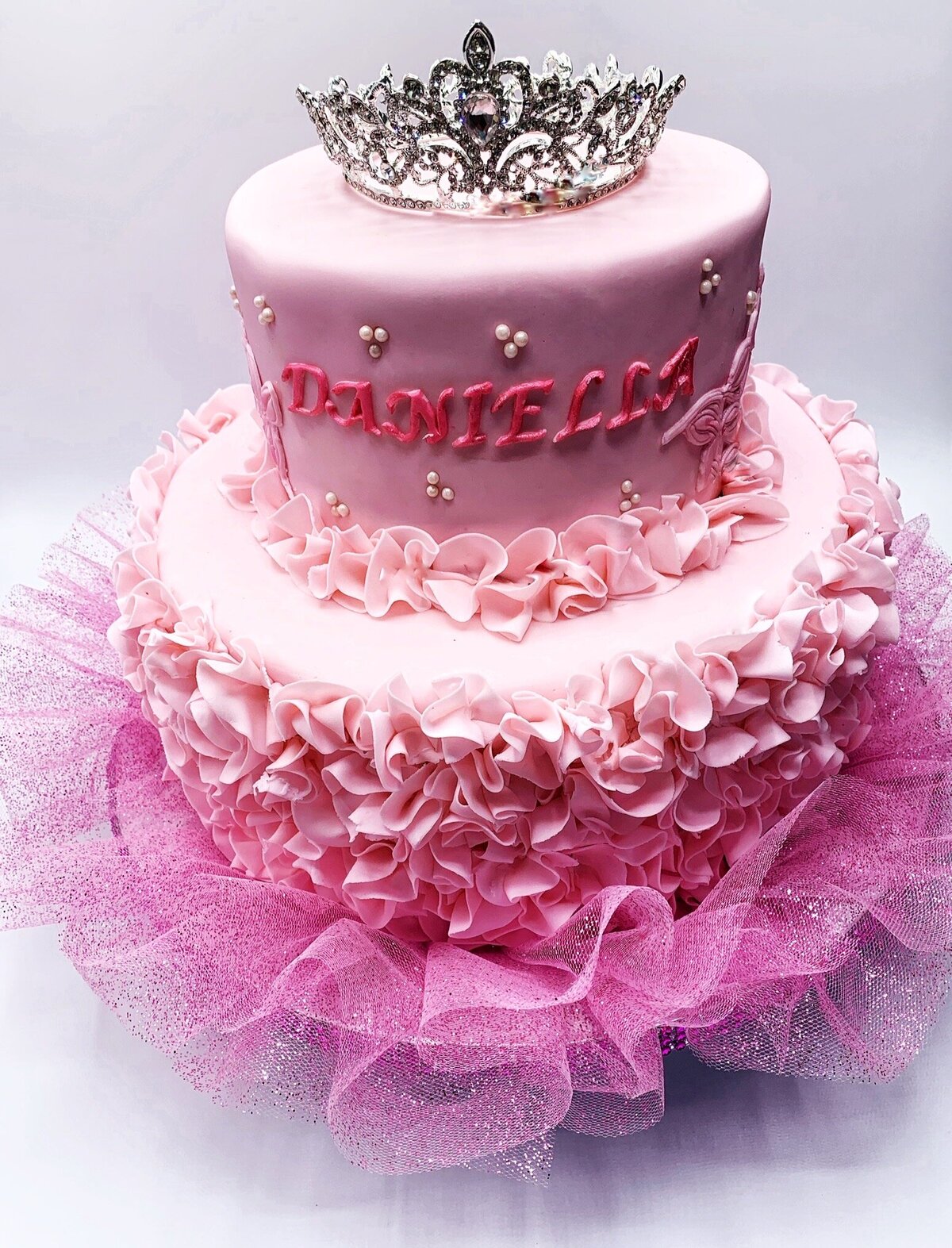 Dressy pink ruffle 2 tier cake with tiara cake topper