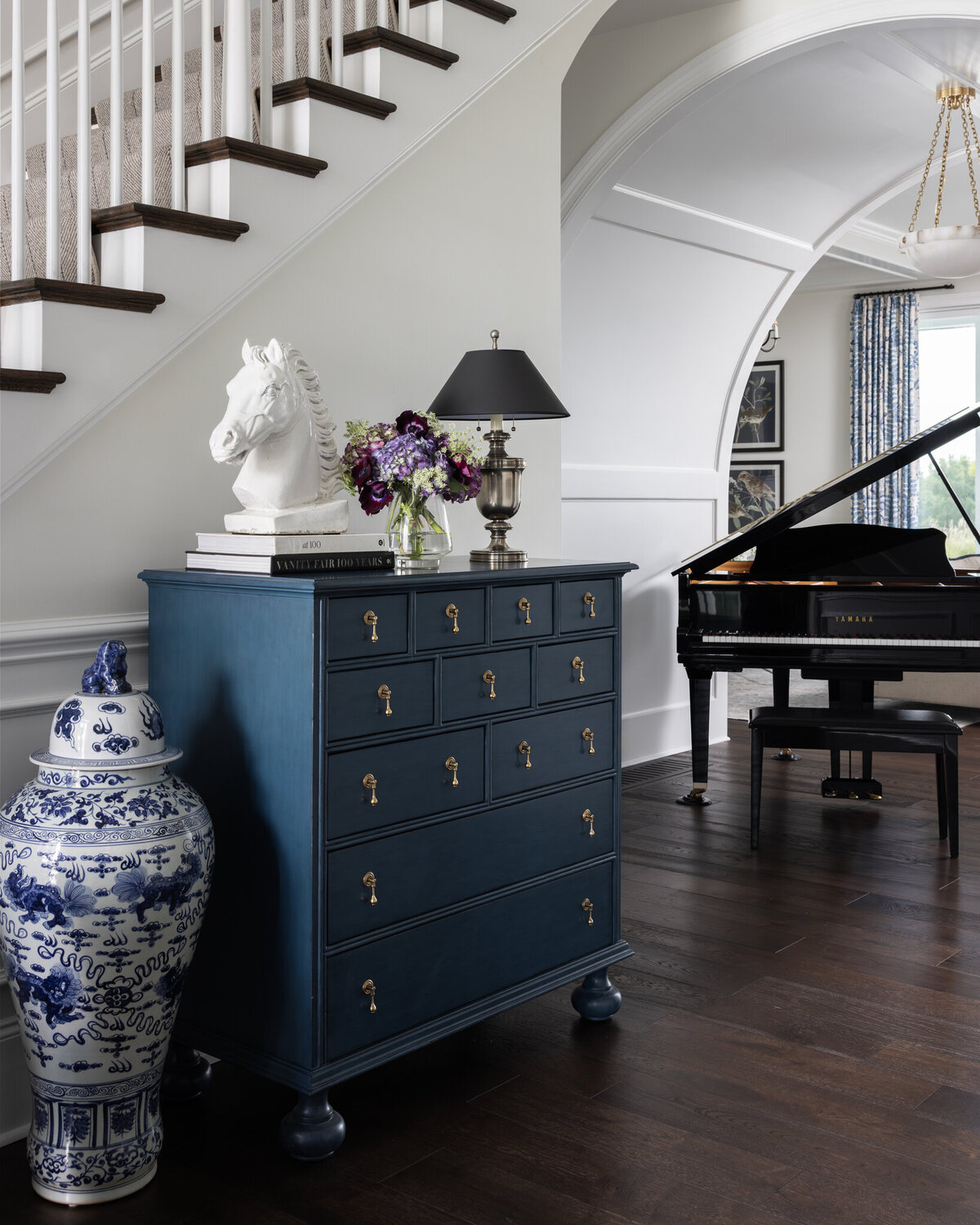 Entry_way_details_with_custom_furnishings_fresh_flowers_and_piano