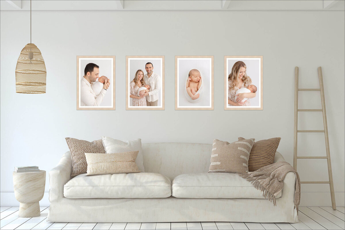 A series of 4 Professional Newborn Photos hanging on a wall above a couch in a veery minimalist, warm neutral room.