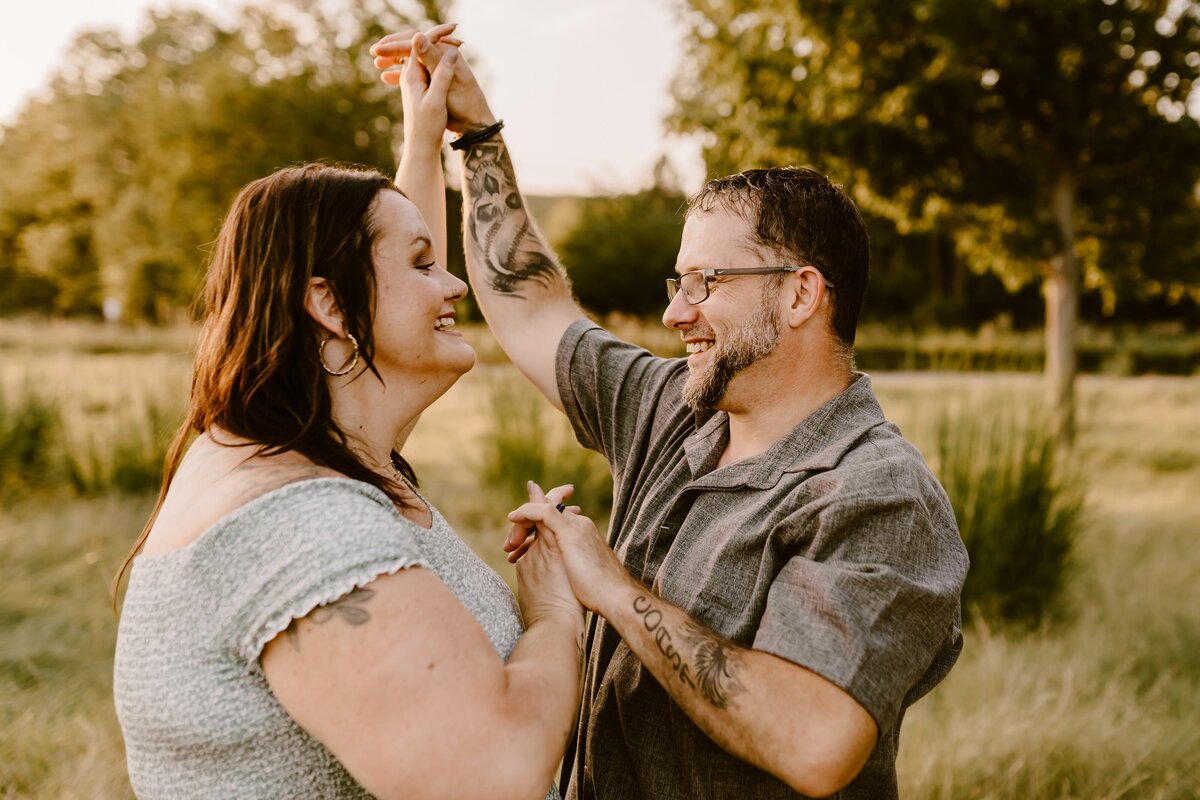 joyful-couple-dancing-summer-evening-ada-hayden-heritage-park-ames-iowa-storyteller-collective-photo-co