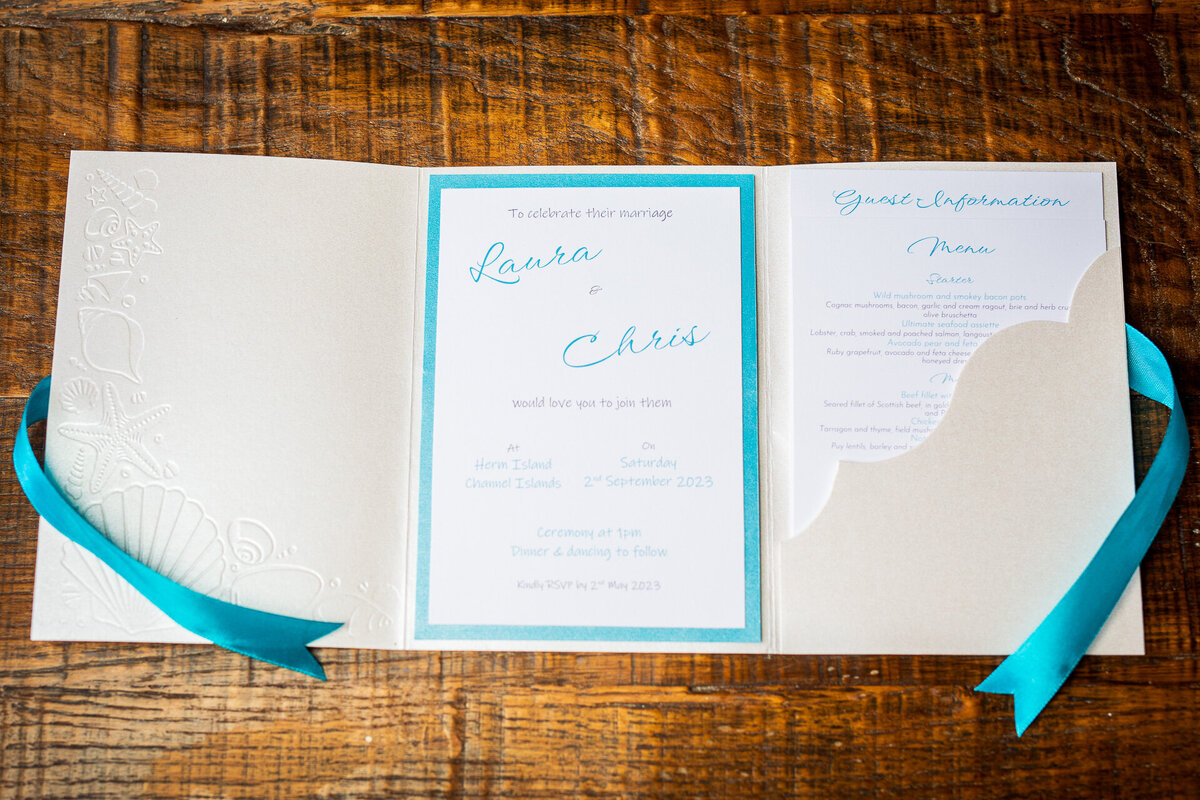 Wallet-style wedding invitation in marine colours