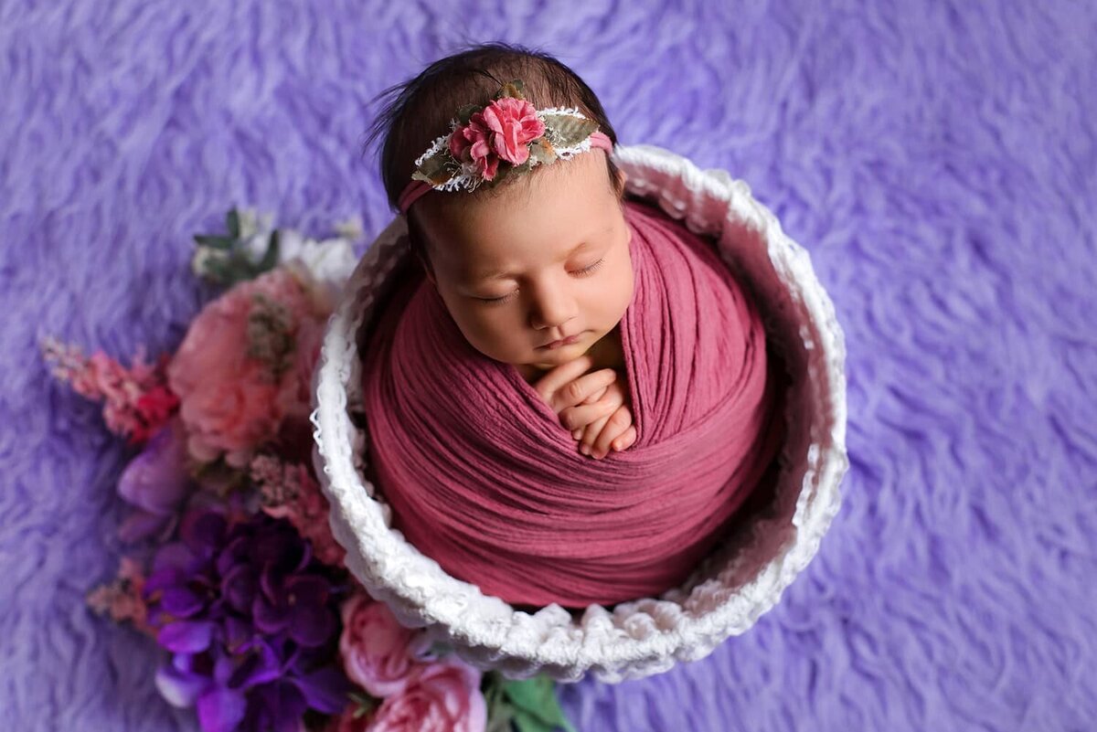 mobile-in-home-newborn-photography-vancouver-fraser-valley_baby-girl-pink-purple-white-wrapped-bucket