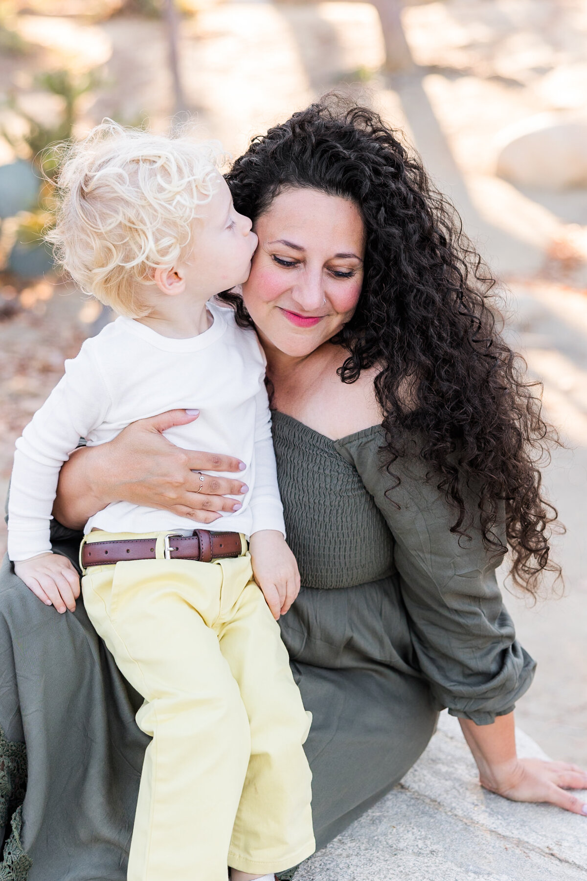 son kissing his mothers cheek