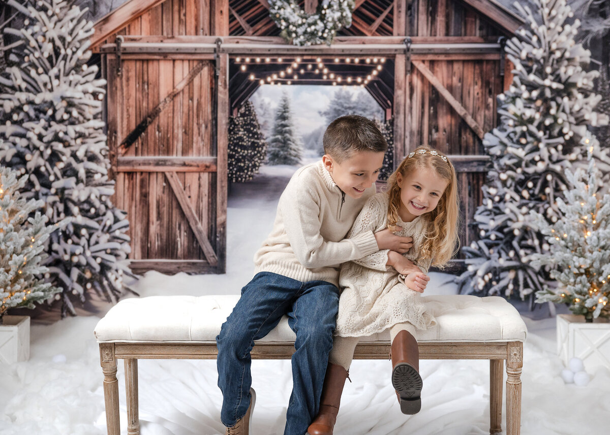 Holiday portrait of relaxed and happy siblings at Allison Reilly's Union County, NJ photo studio.