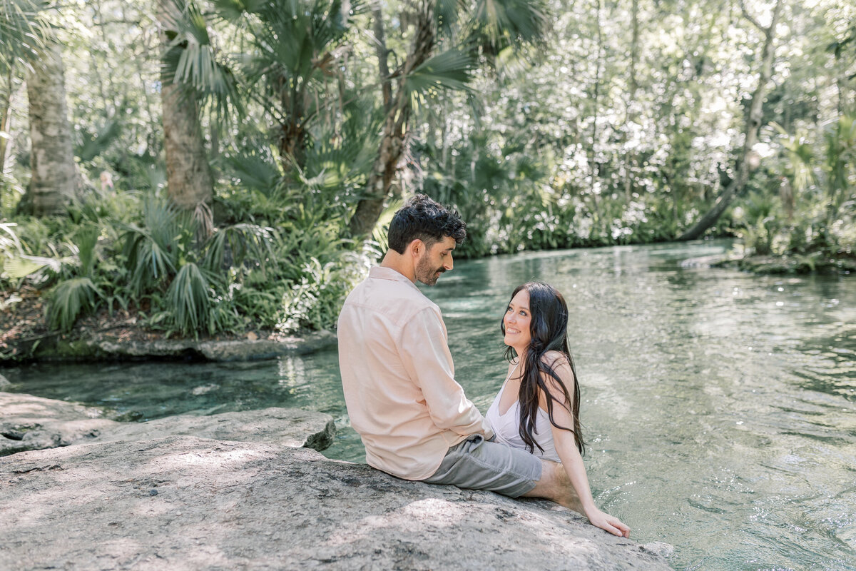 Bride and groom go swimming at a Florida Spring as one of the elopement activities.