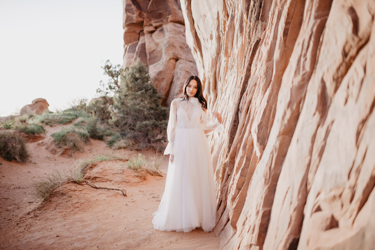 Utah elopement photographer captures bride outdoors in wedding dress