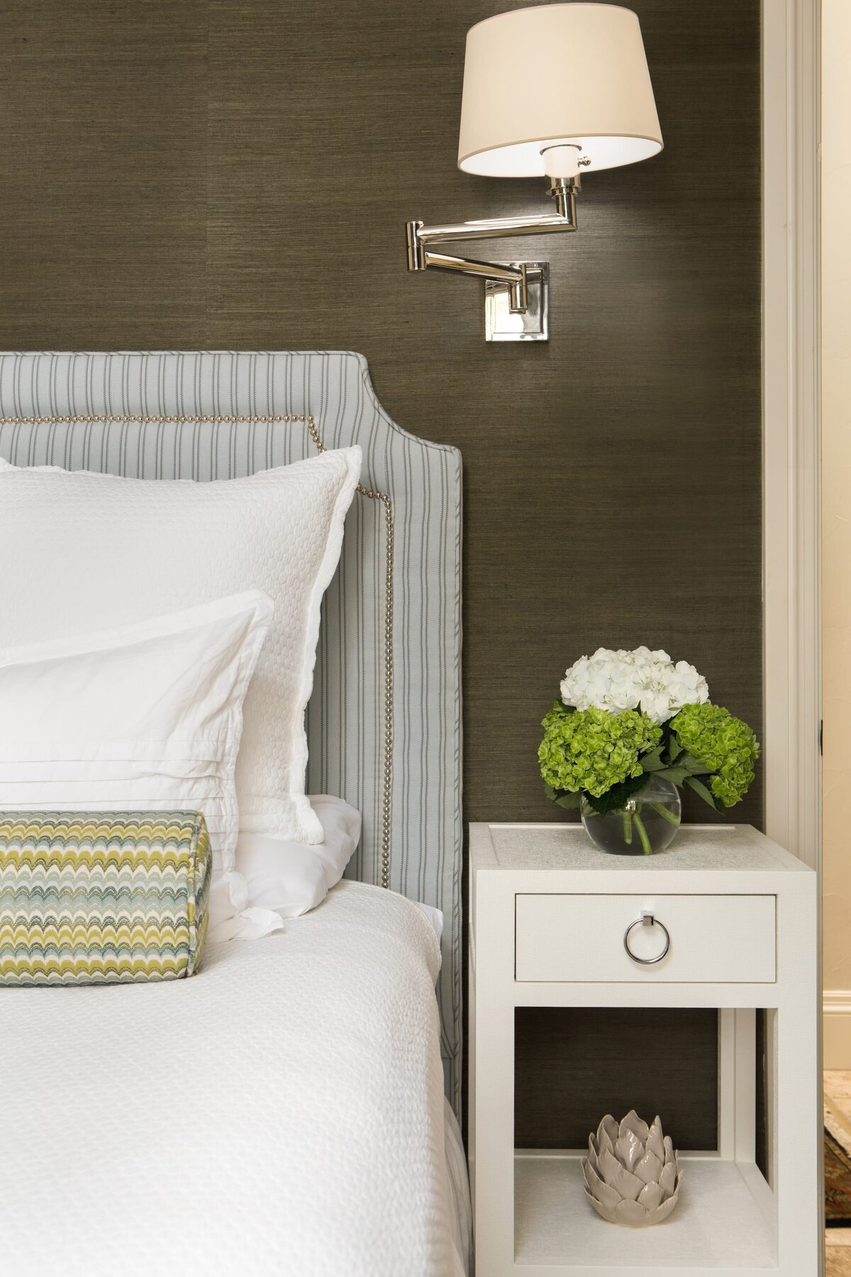 the keeping room interiors grandview bedroom white bedside table with glass vase of flowers