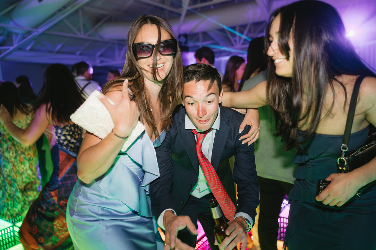 Guests dancing on dance floor at reception at El Chorro