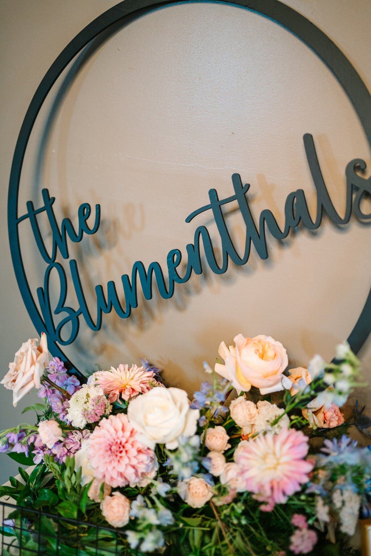 Wedding welcome sign  with a colorful flower arrangement.