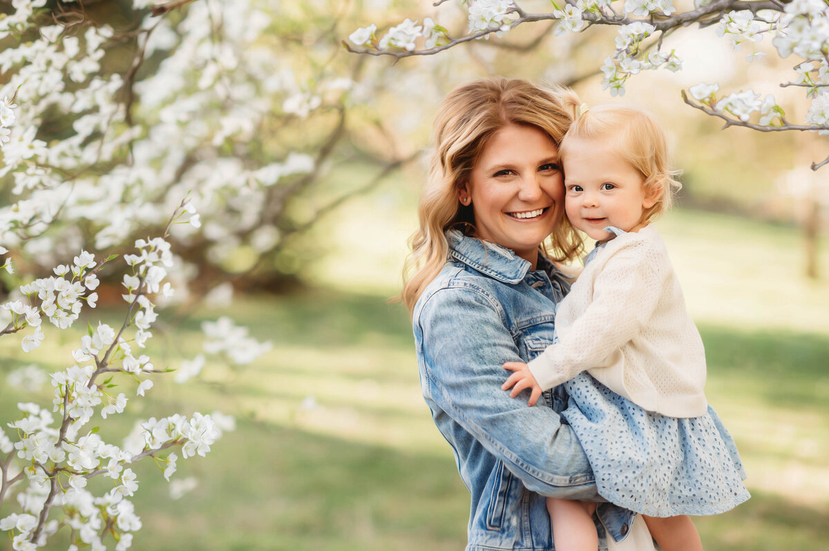Mother embraces her baby during baby photoshoot in Charleston, SC.