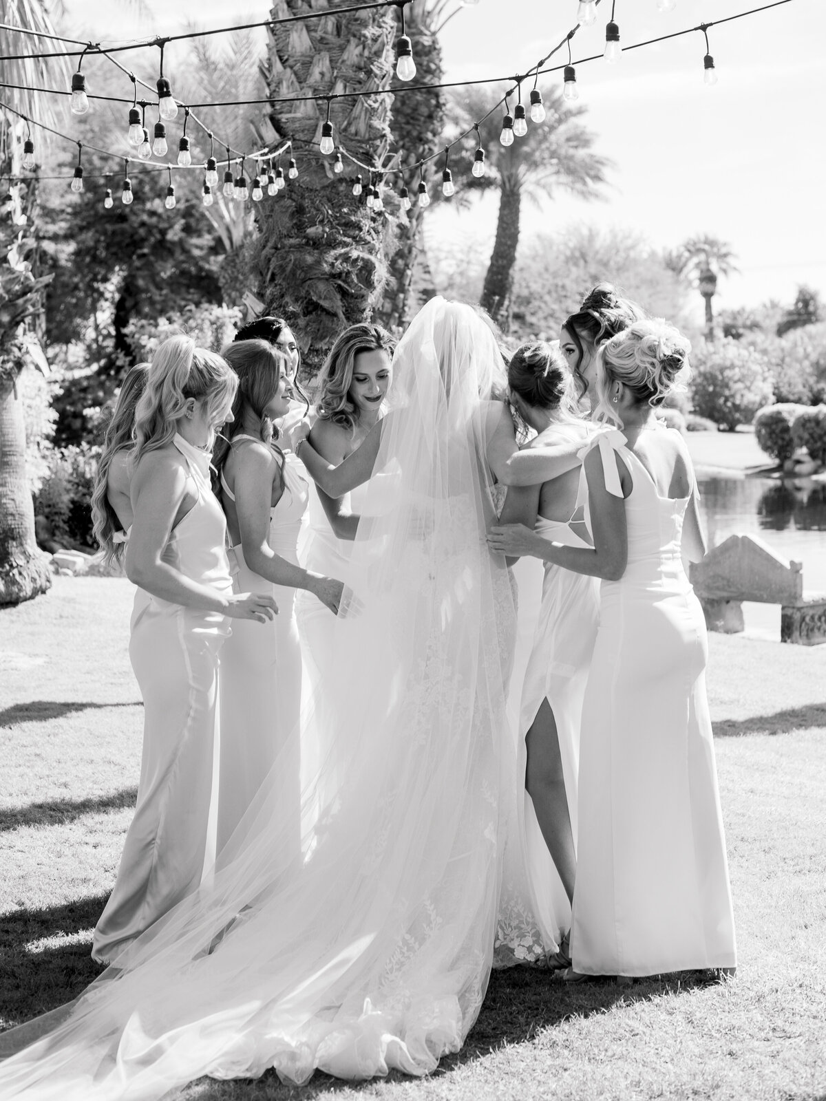 bride-emotional-moment-with-bridesmaids-indio-wedding-bougainvilla-estate.jpg