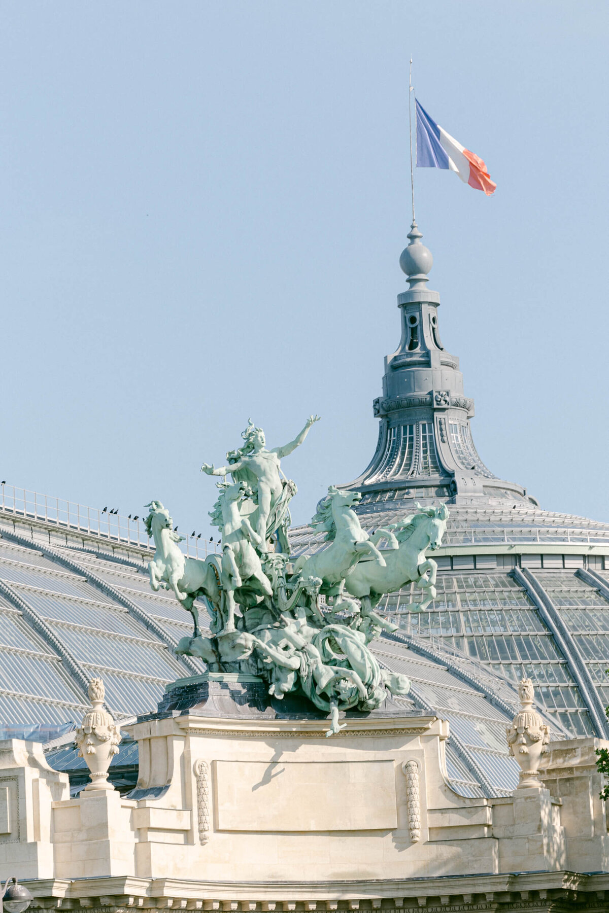 A wedding photo showing off the architecture of Paris