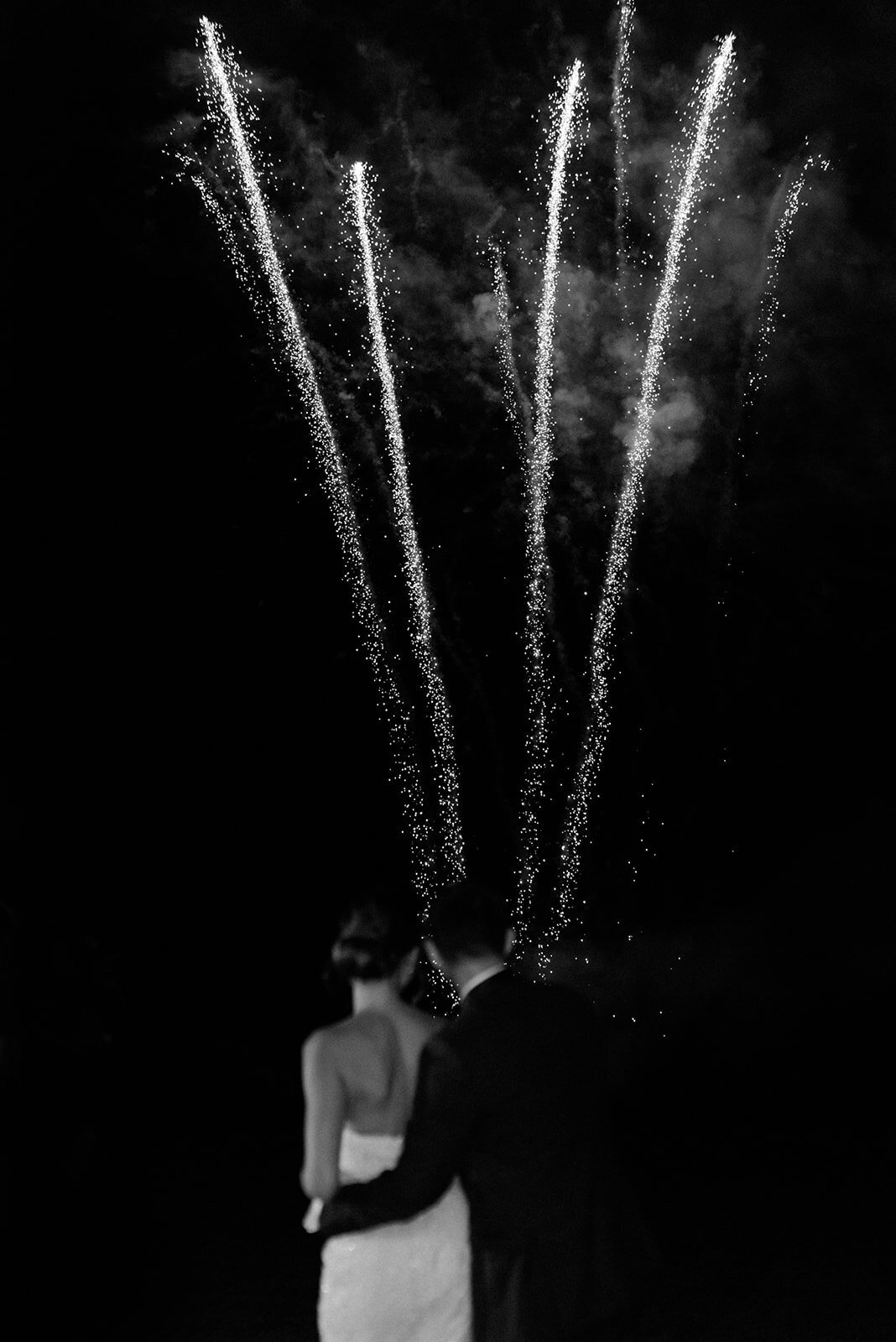 Newlyweds watch as the signature Glenmere Mansion Wedding fireworks go off