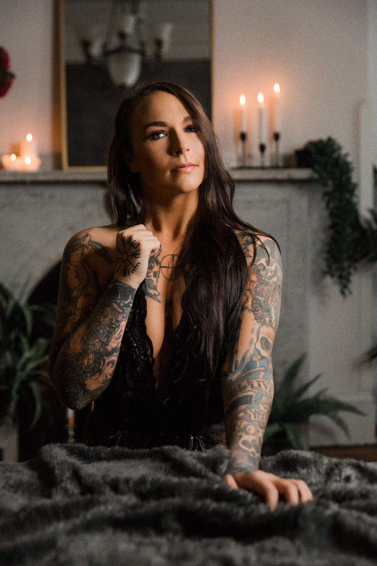 Woman with long dark hair in candle lit room