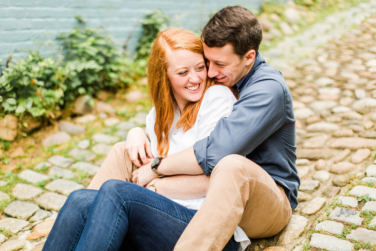 young couple hug for engagement photo