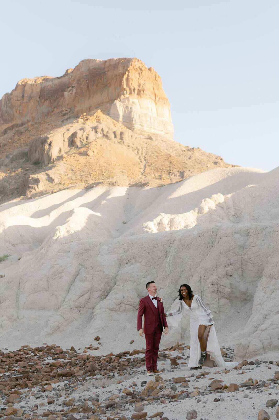 couple dresses back up for a day after couples session to explore volcanic rocks