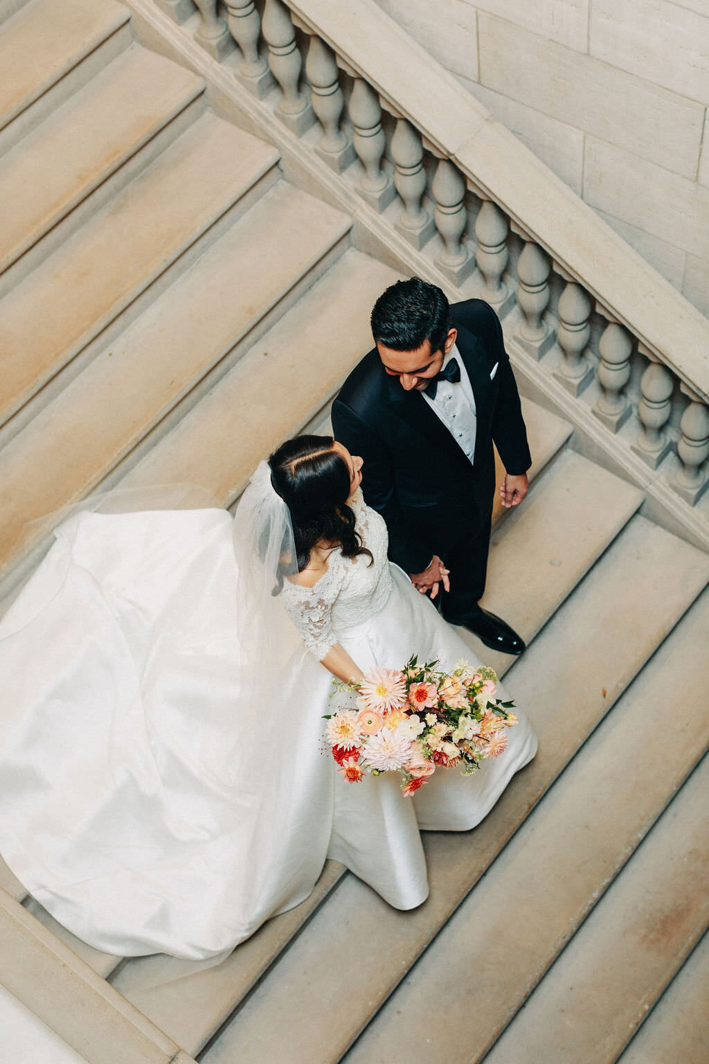 brideandgroom-holding-hands-on-stars-glenmere-mansion
