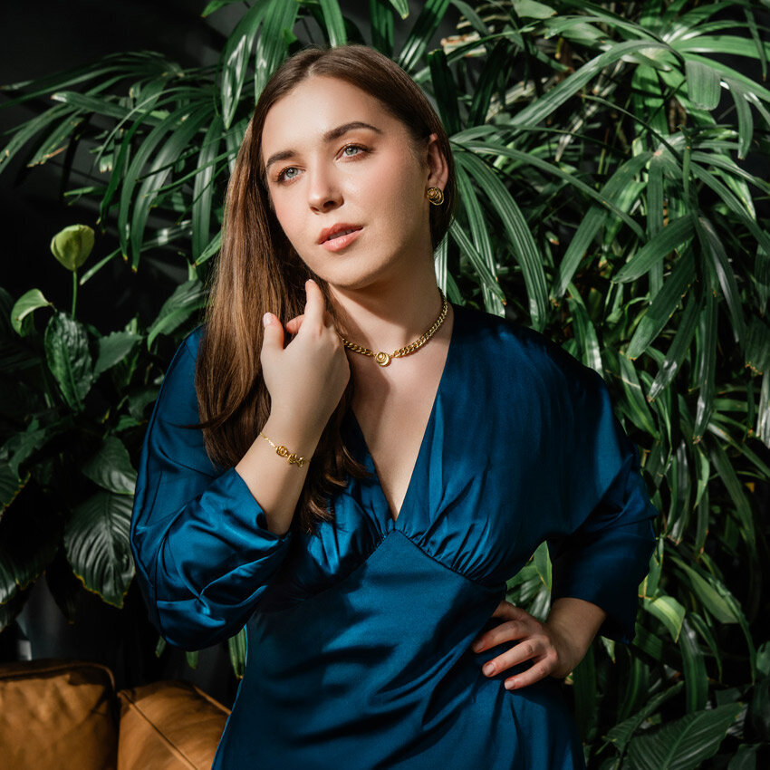 gold filled vermeil yellow gold jewellery on model in blue dress 