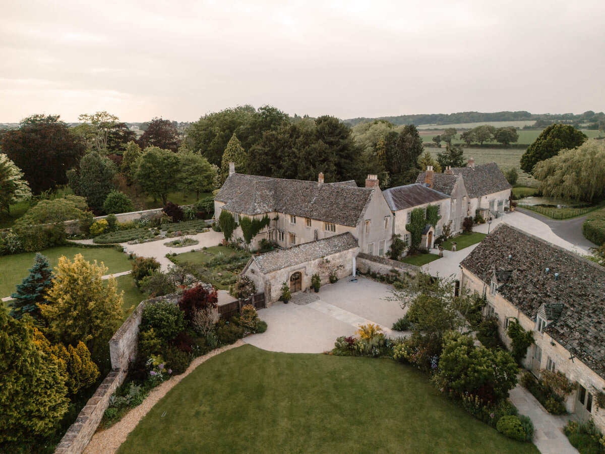 Aerial drone view of the historic Caswell House estate in the Cotswolds countryside