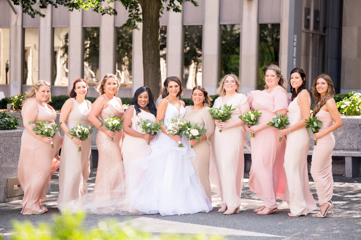 bridal party photo on mellon green outside of omni
