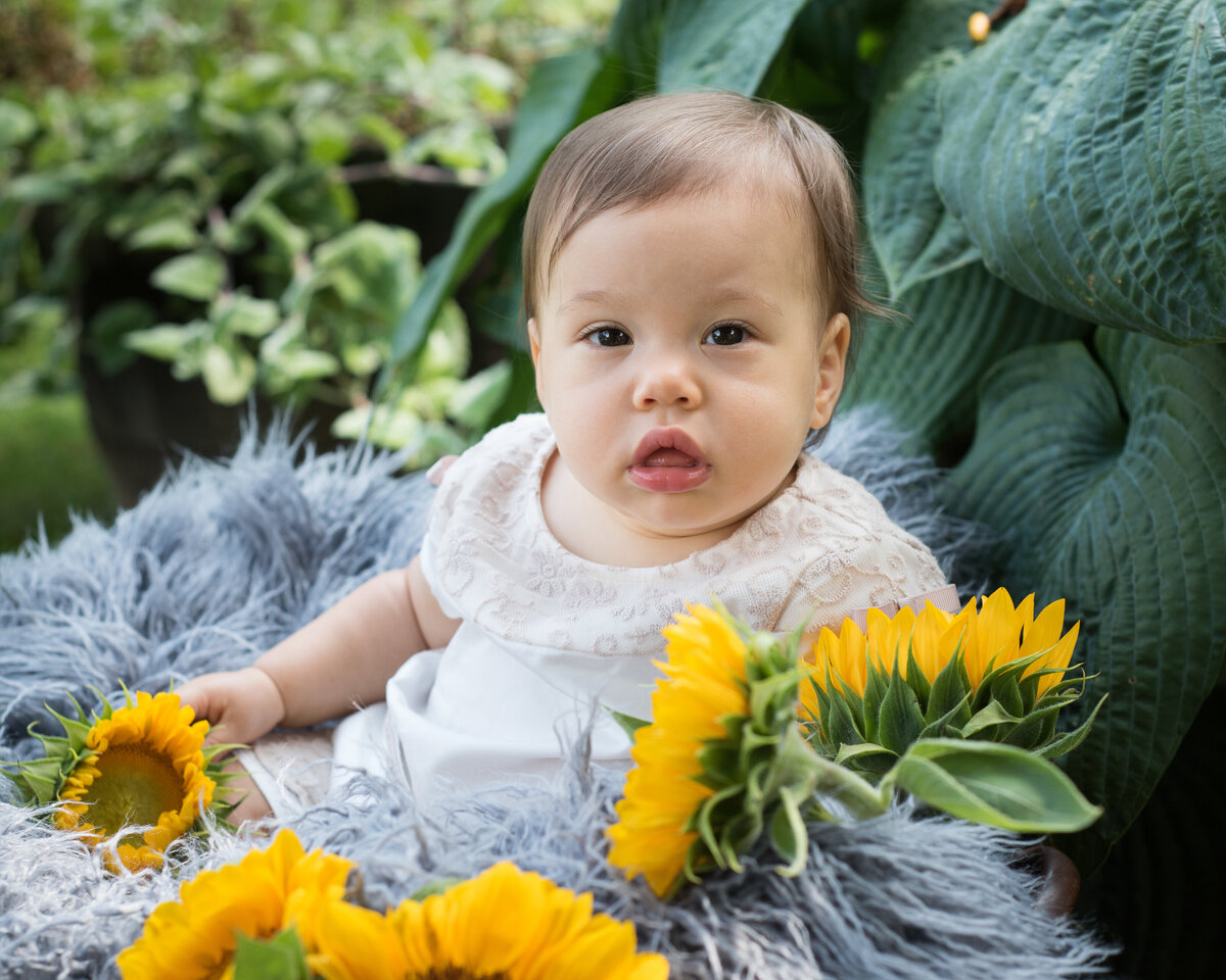 Child and sunflowers