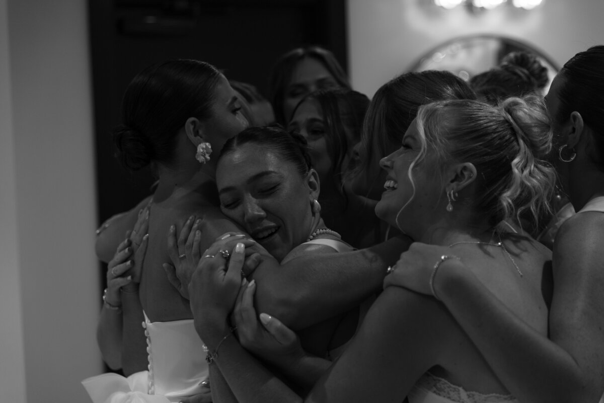 Co Bride Hugging her Bridesmaids 