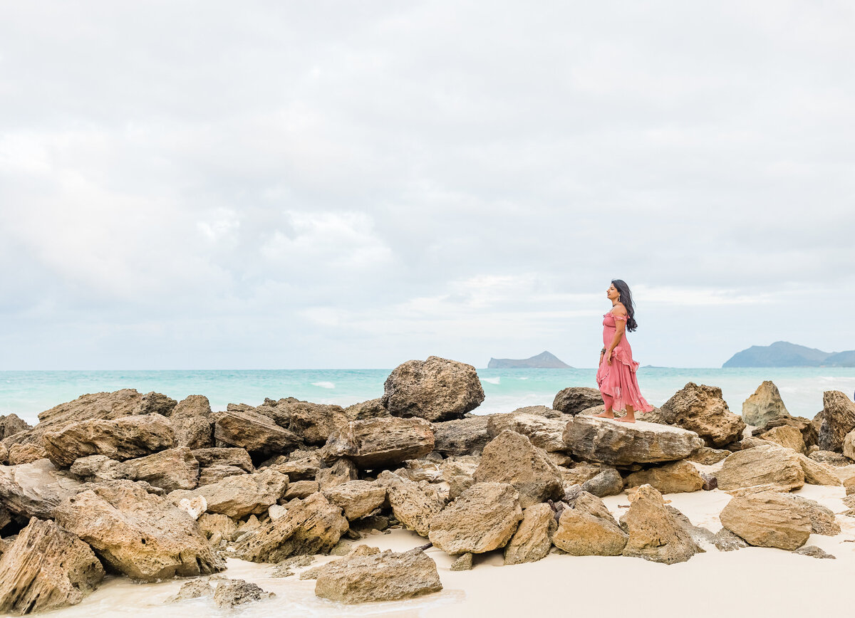 Life coach Radhika standing outside with mountains and ocean in background