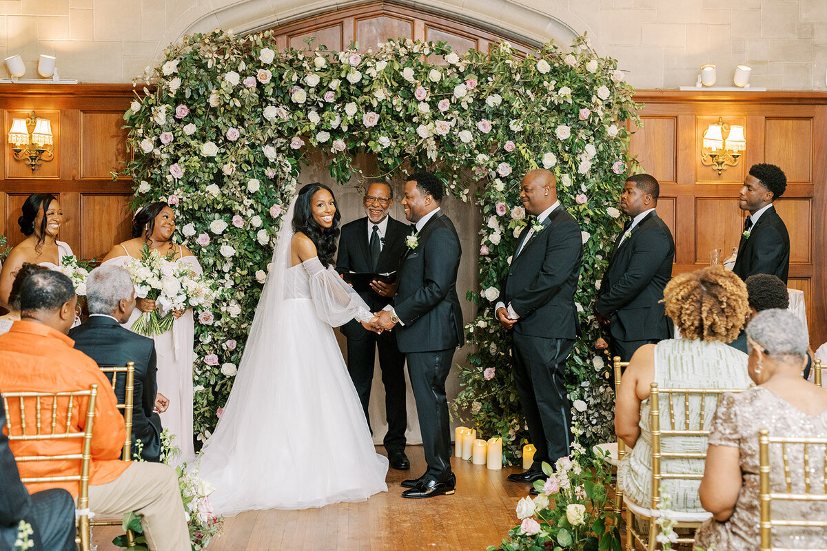 black-bride-smiling-at-guest-as-she-takes-her-vows-elizabeth-austin-photography