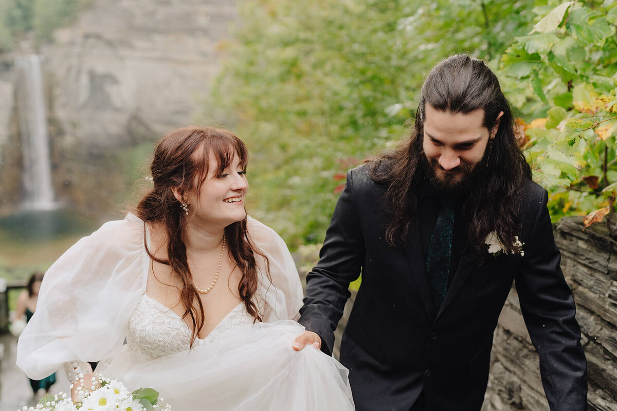Bride and groom just married at waterfall wedding, Finger Lakes, NY