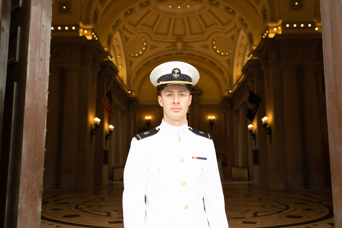 Navy officer in white uniform at Bancroft Hall in Annapolis, Maryland.