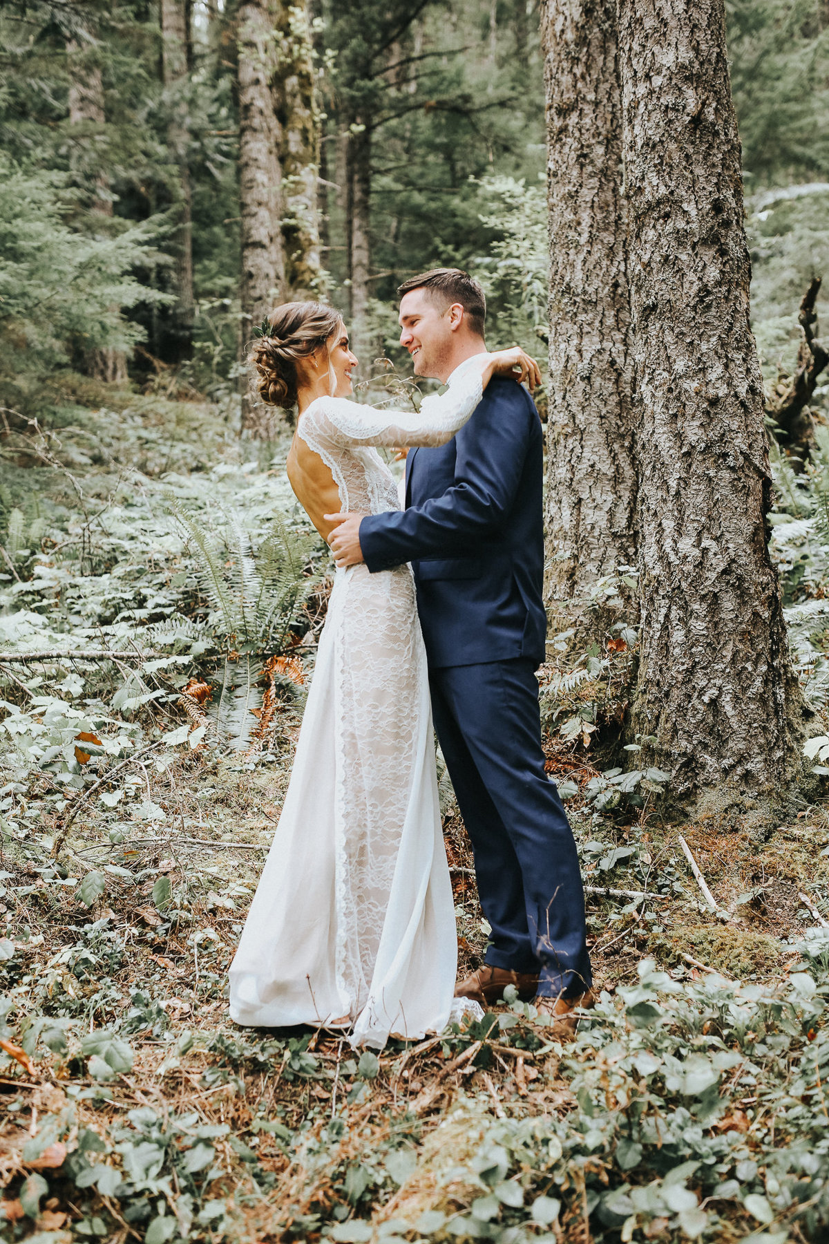 First look with bride and groom in the woods of Port Angeles, Washington