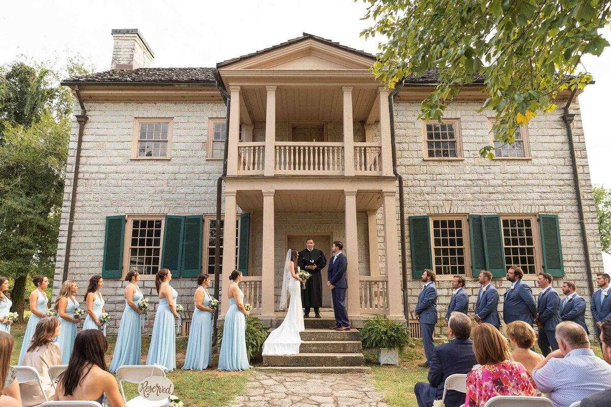 Bride and groom with bridal party at wedding ceremony 