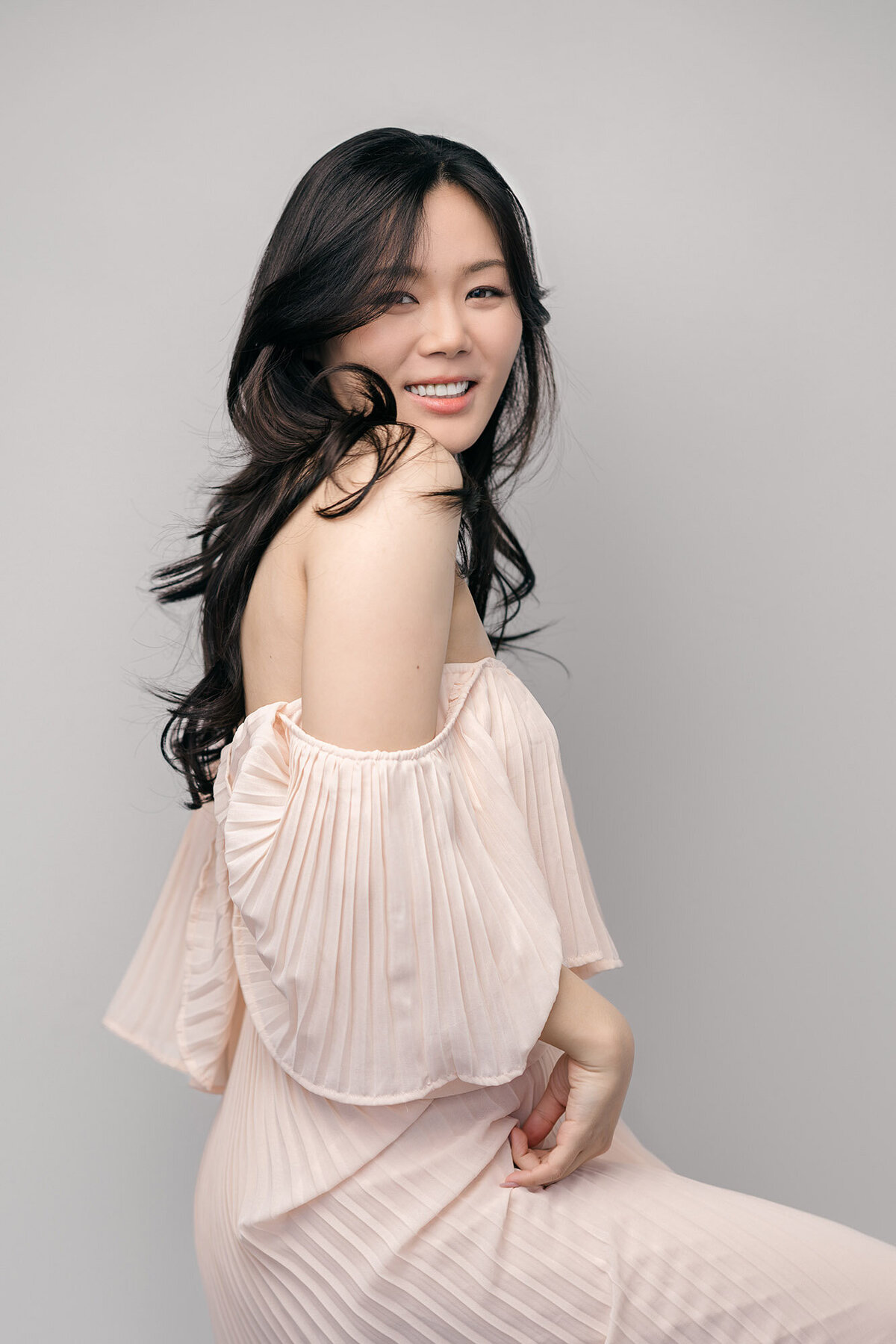 michelle-editorial-portrait-woman-dress-coral-smiling