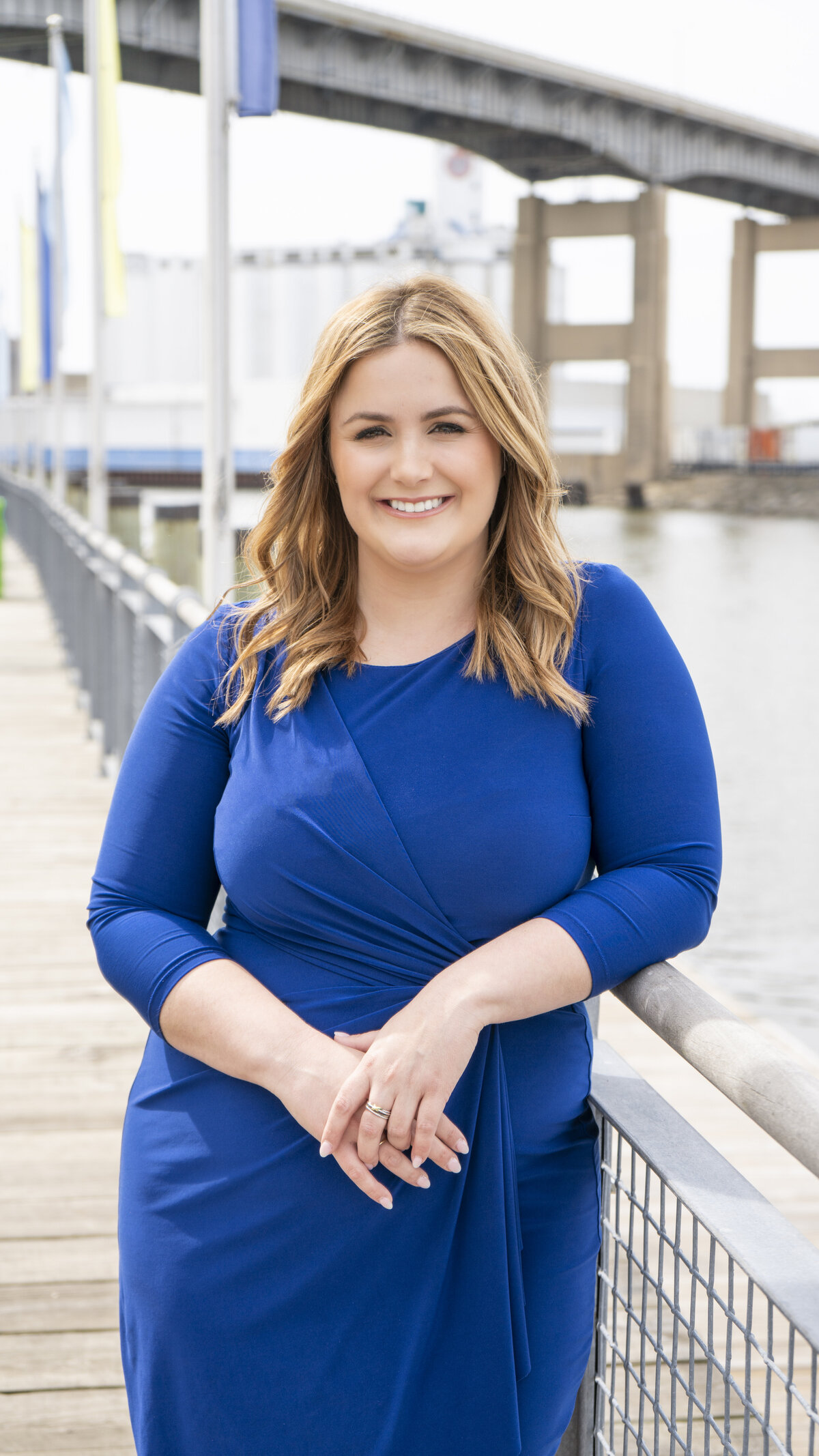 Headshot of a meteorologist in a blue dress