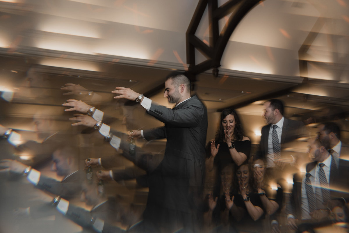 Creative portrait of groom dancing at reception Mystic, Connecticut