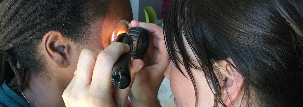 Students learn how to read iris markings in Iridology training.