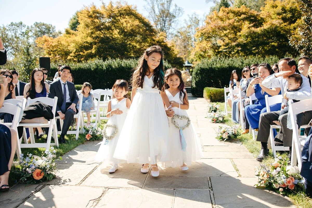 Flower girls walking in the aisle