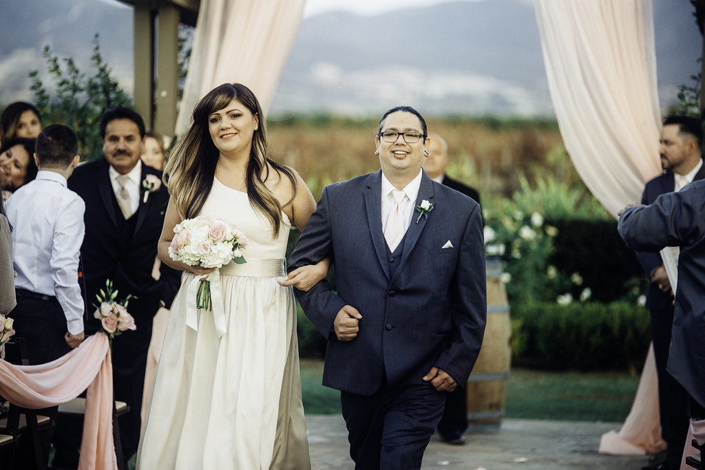 Wedding Photograph Of Bridesmaid And Groomsman Walking Los Angeles