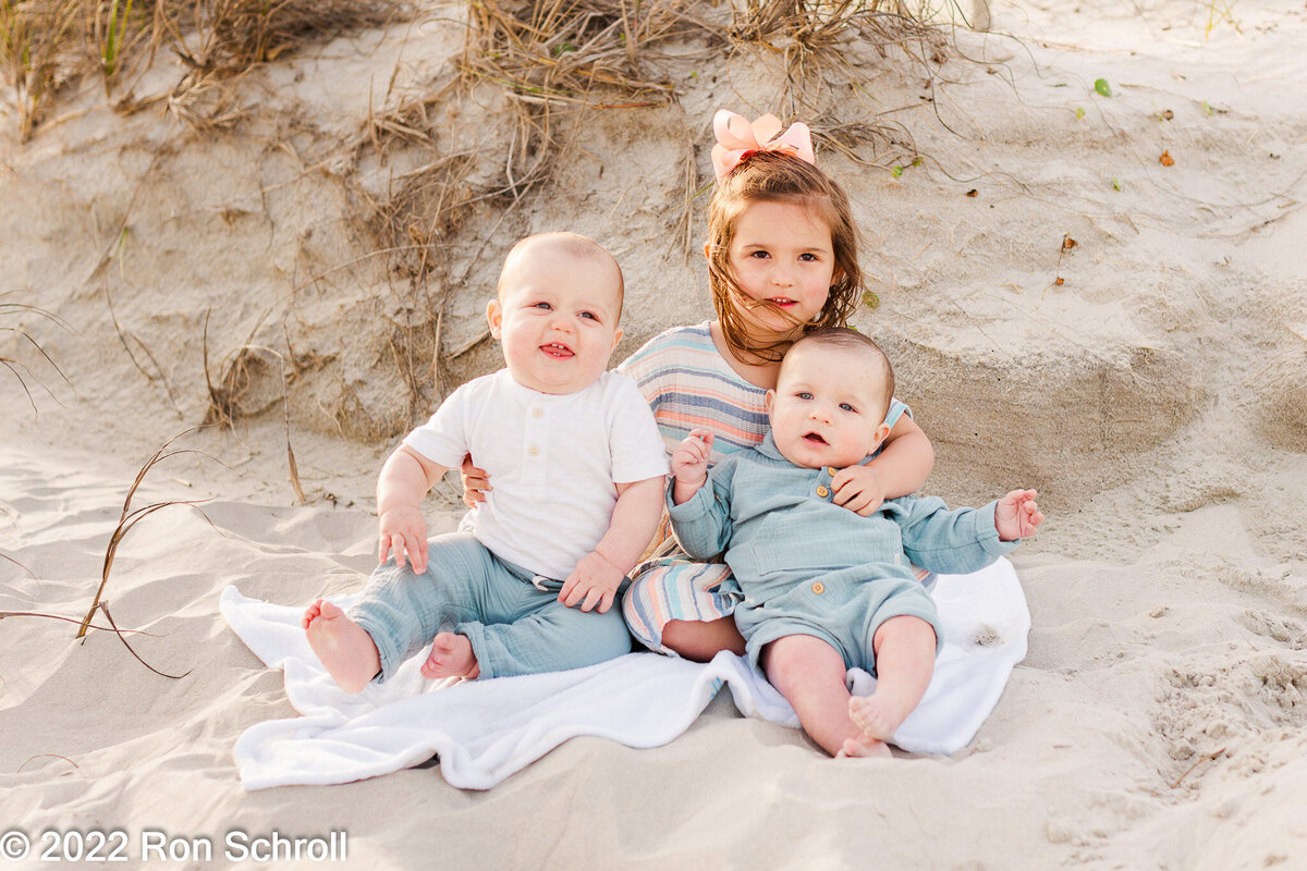 Darling kids photos by the sand dunes at the beach with Ron Schroll Photography at Ocean Isle Beach, NC