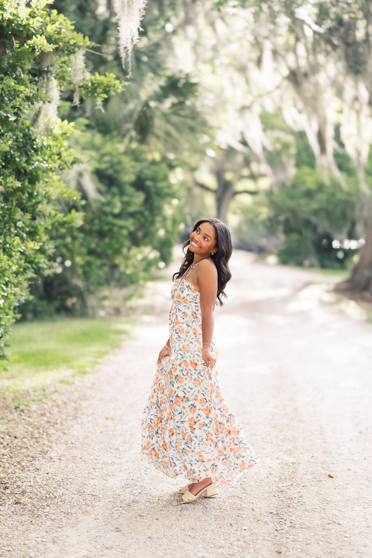A classic senior portrait amid the historic beauty and floral landscapes of Rosedown Plantation, beautifully documented on film by Morgan Alysse, Louisiana film photographer.