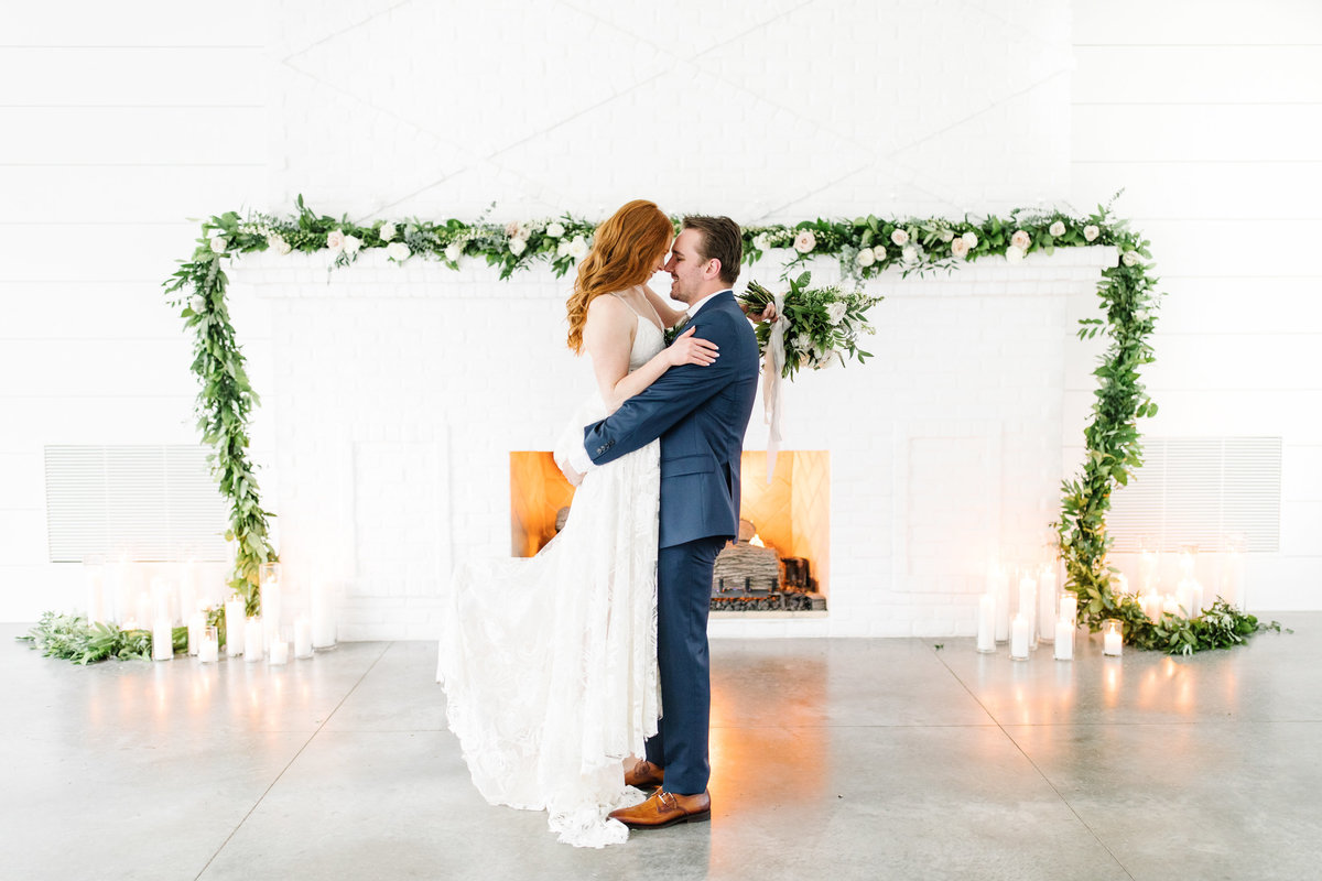 Hutton-House-Fireplace-Bride-and-groom-florals-Kiss-Luxury-Wedding
