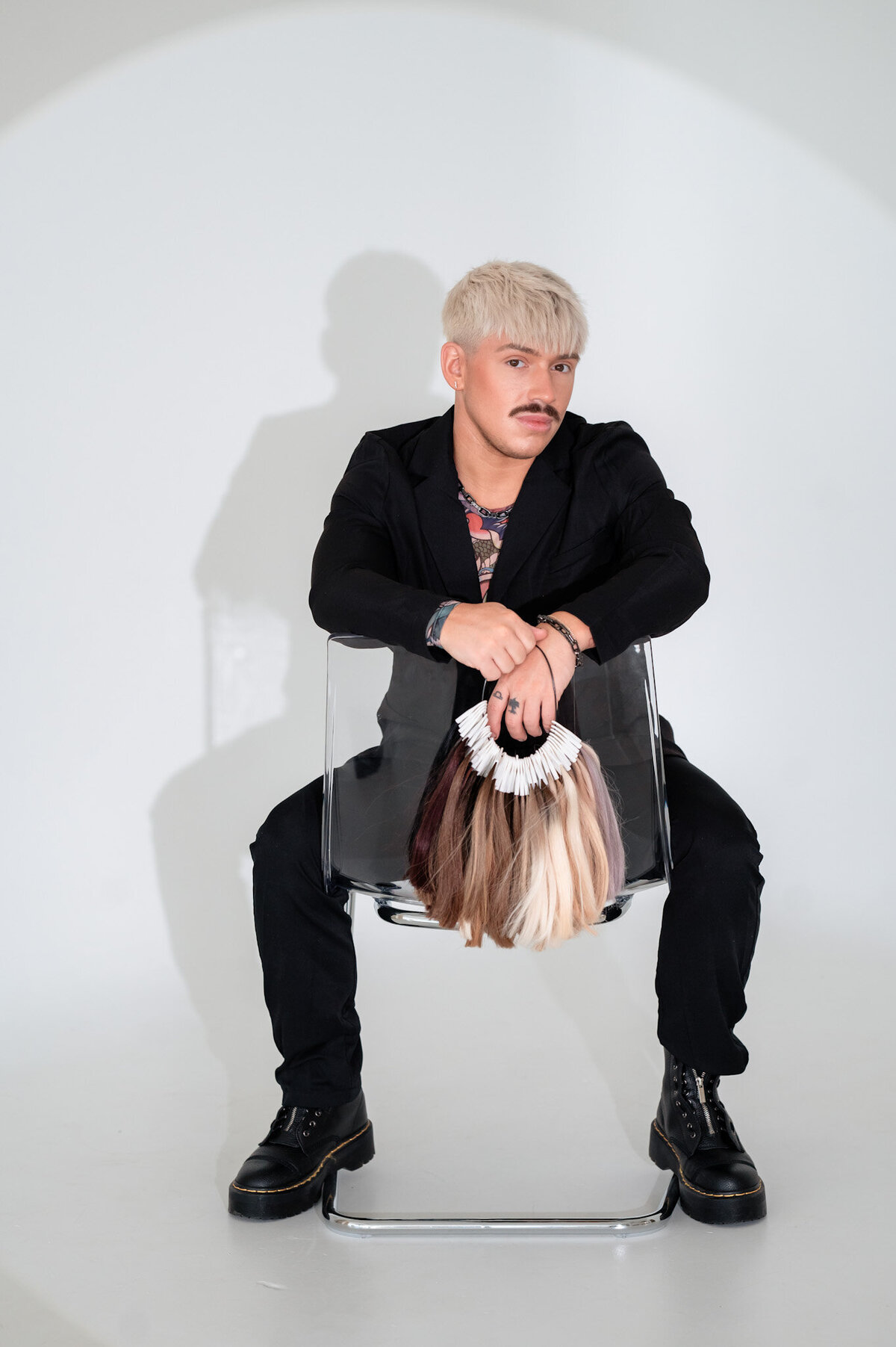 handtiedbyhim-stylist-branding-session-posing-with-chair