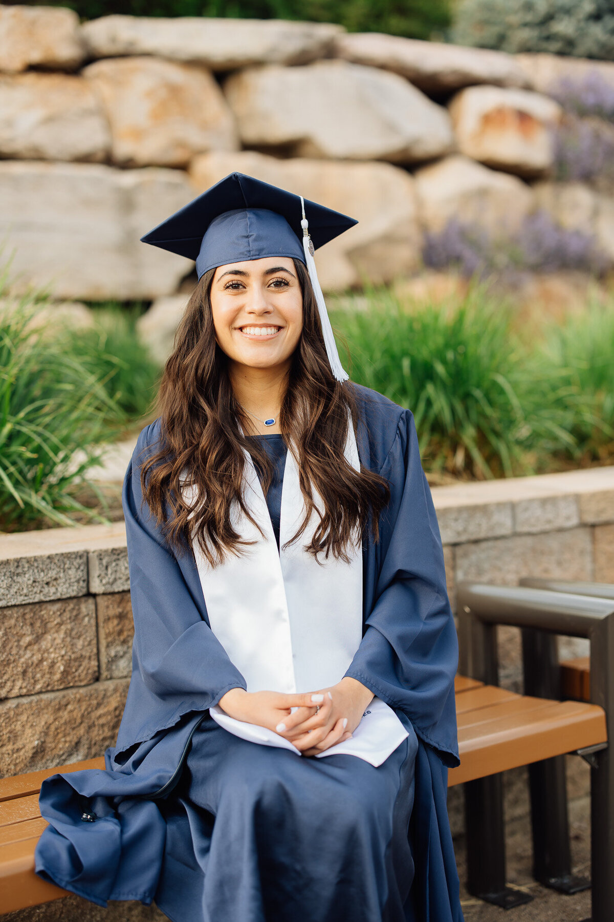 woman smiles at byu graduation portrait session